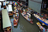 Thailand, Locals sell fruits, food and products at Damnoen Saduak floating market near Bangkok 